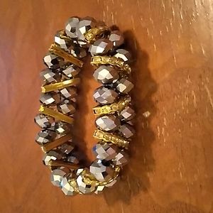 2/$12. Lovely grey and gold tone stretch bracelet